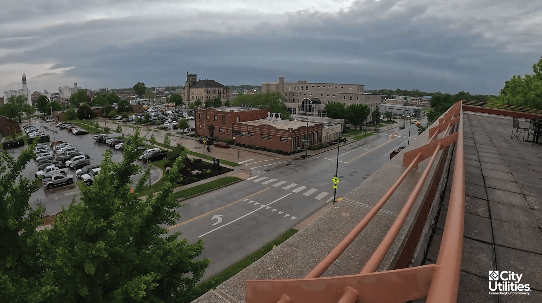 A view of a city street with a crosswalk and a building in the background. AI generated content