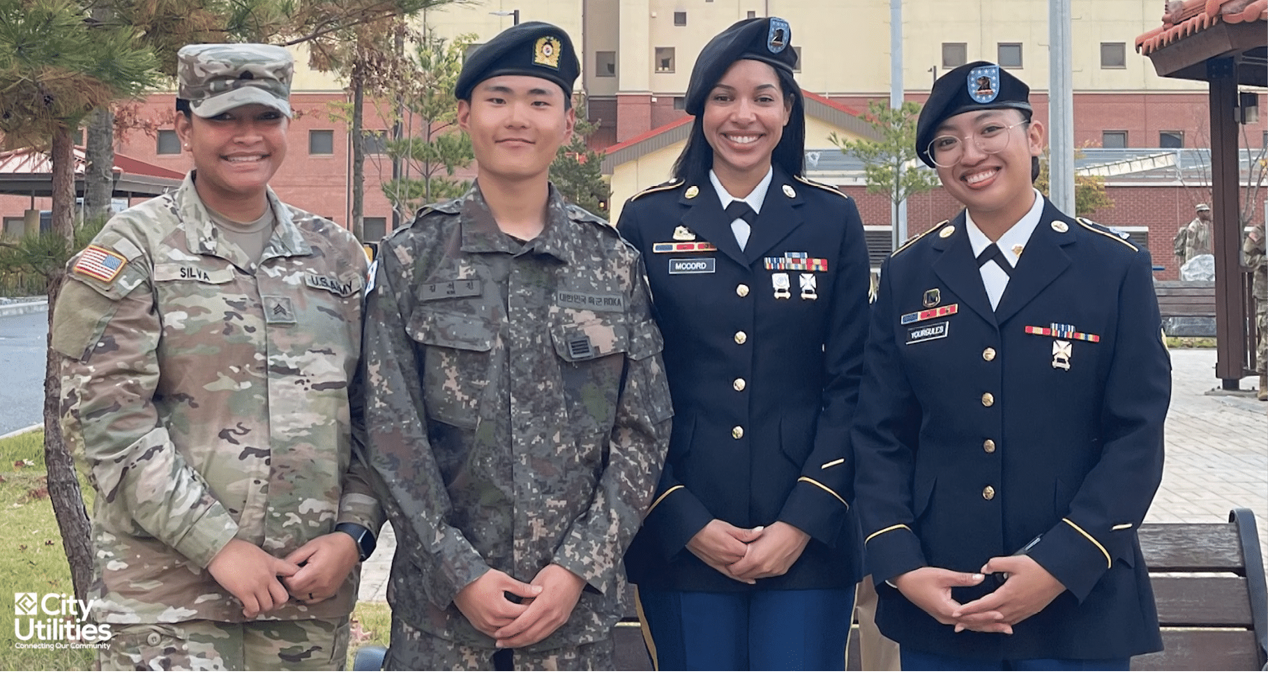Four women in military uniforms pose for a picture. AI generated content